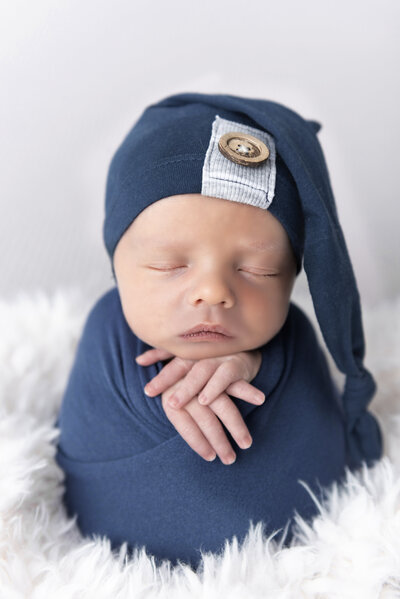 newborn boy wearing hat