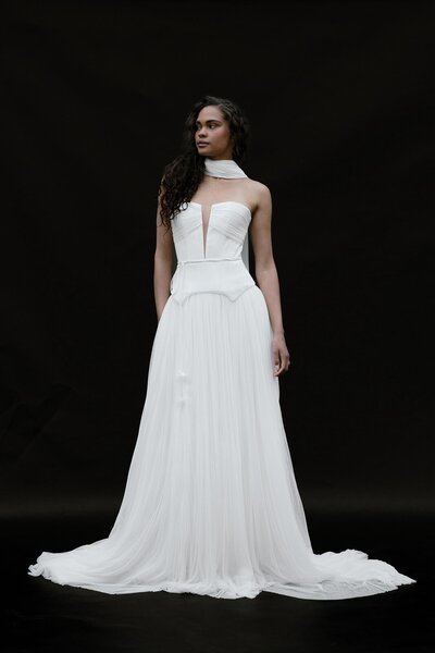 black and white image bride wearing feathered wedding dress