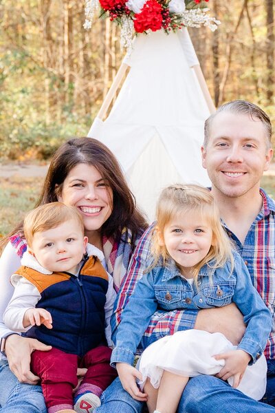 family of 4 smiling during Centreville, Virginia family photography