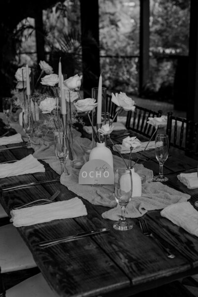table decorated with flowers and candles