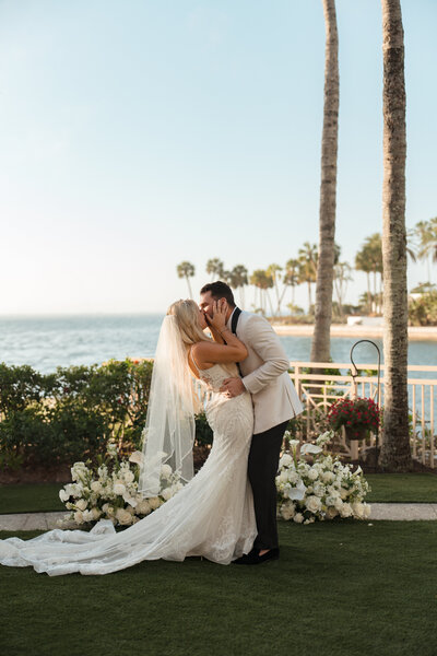 Bride and groom celebrating their elegant wedding at The Ritz-Carlton Sarasota, Florida—capturing timeless romance and luxury at a waterfront venue, planned by Watters & Co. Events.