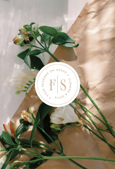 Florist logo overlaying photo of flowers
