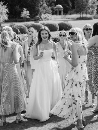Bride with friends at garden reception