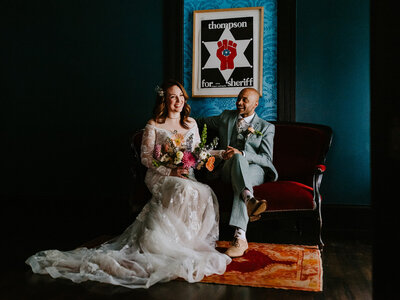 wedding couple laughing in artistic lounge
