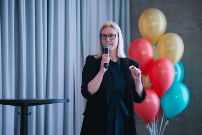 Jenny Moran on the stage speaking at the Magnet Employer Branding Awards 2025