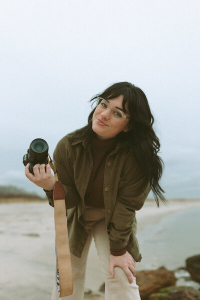 Photographer with their camera on a beach