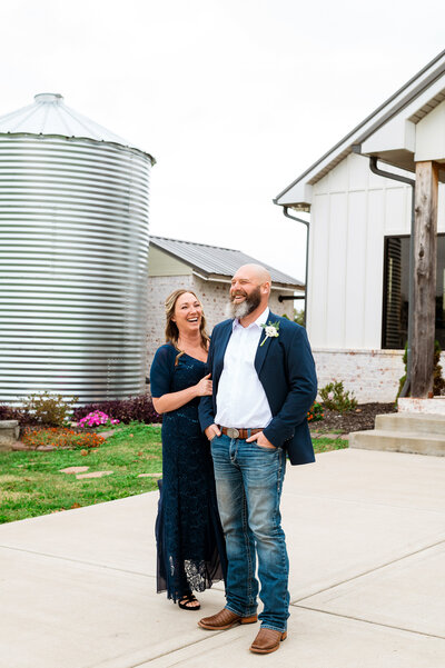 Newlyweds snuggled together laughing