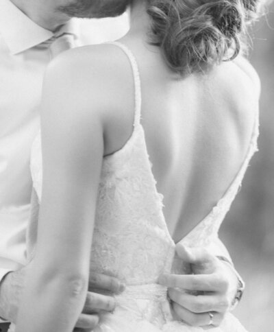 groom and bride embracing
