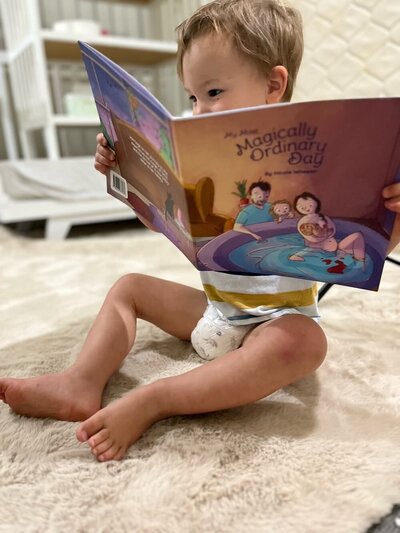 Child reading book about homebirth