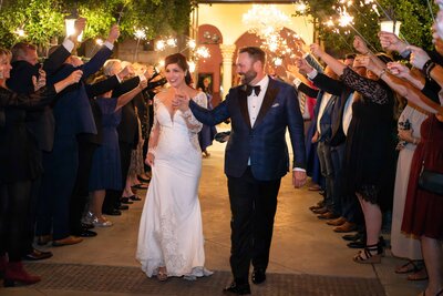 Bride and groom make their wedding exit through sparklers