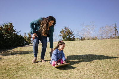 San Antonio Photographer Irene Castillo playing with her daughter at the Botanical Garden for instagram picture @irenesplanit