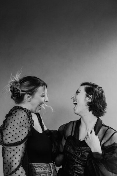 two models laughing and goofing around