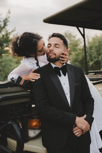 Adventurous bride and groom together on a South African safari, capturing a unique and breathtaking wedding moment amidst the wild landscape.