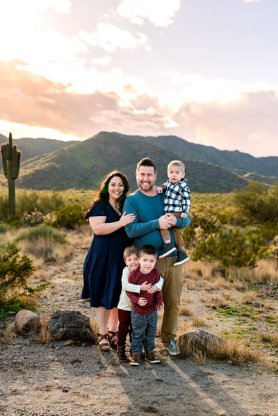 Parents with young kids laughing in Arizona during photography session