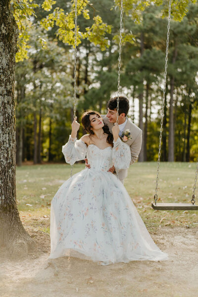 bride-and-groom-swing-spring-elopement-in-arkansas