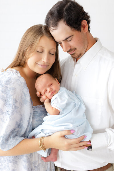 newborn baby girl sleeping on a white pillow with Constance Calton photography in Savannah, Ga