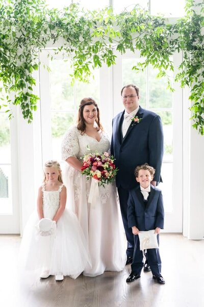 Bride and groom with ring bearer and flower girl