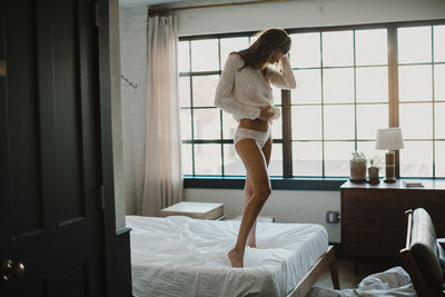 Soon to be bride does a boudoir session at Lokal Hotel, photography by Sweetwater.