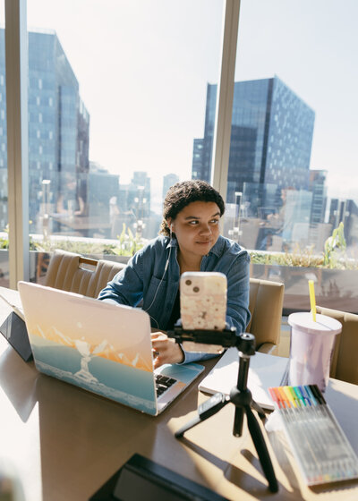 Catryce at Desk with Devices