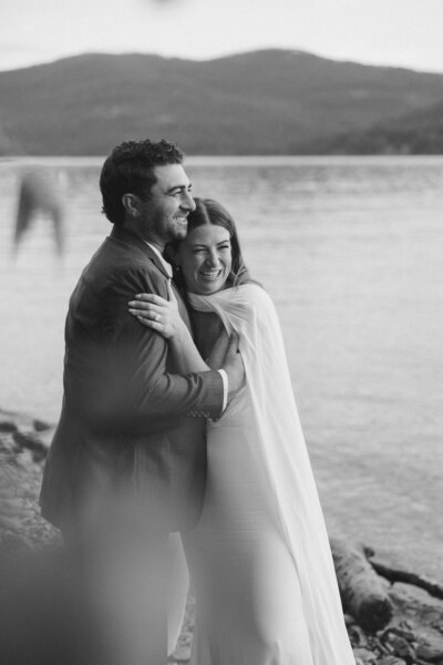 couple hold hands at sun point overlook in glacier