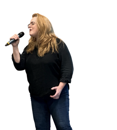 M.J. Johnson voice student singing with microphone
