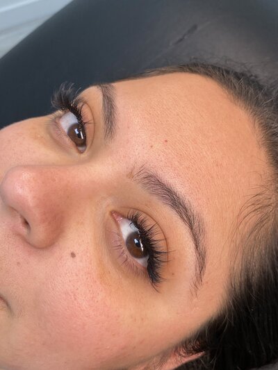 This portfolio image captures a stunning set of volume lash extensions created by Book Sothana in Jacksonville, FL. Volume lashes offer a fluffy, soft, and fuller look, perfect for clients who want a little extra glamour while maintaining a lightweight, natural feel. Using expert technique, licensed esthetician Sothana applies multiple ultra-fine extensions to each natural lash for a lush but never heavy effect. Clients love how volume lashes enhance their eyes, add depth, and create effortless beauty without the need for daily mascara. Every lash service is customized to fit your unique eye shape, lash health, and personal style goals. Book Sothana’s private studio delivers professional, safe, and relaxing lash services that make every appointment a calming experience. Located at 9303 Baymeadows Rd 105, #120, Jacksonville, FL 32256. Call (904) 597-0867 or visit https://booksothana.com/ to schedule your volume lash extensions today!