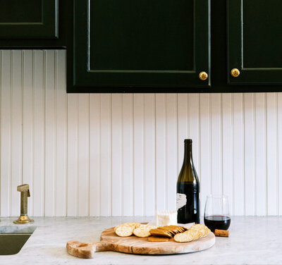 Bottle of wine on white table