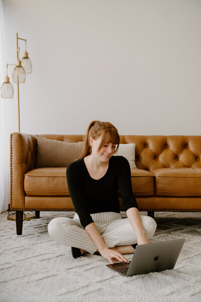 Woman sitting with laptop