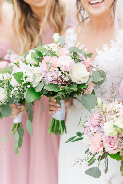 a Wisconsin bride and her bridesmaids holding flower bouquets