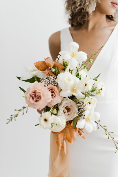 Bride holding wedding bouquet