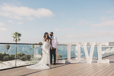 bride and groom pose for portraits after their destination wedding ceremony
