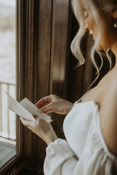 bride reading vows during her montana wedding 