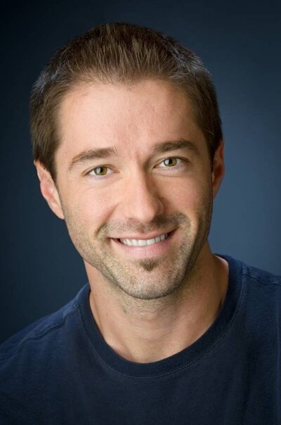 Casual professional headshot of man with natural smile in NYC studio by Alex Kaplan Photography