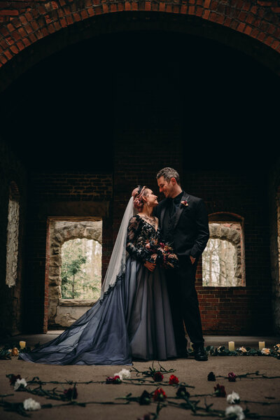 Gothic Wedding couple walks at Squire's Castle.