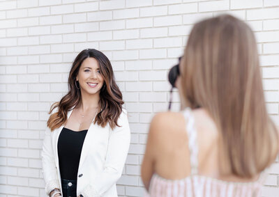 Kelly Klemmensen taking a brand brand photo of a female entrepreneur