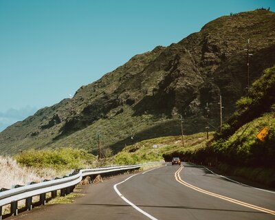 Scenic highway winding along the mountains on the west side of Oahu