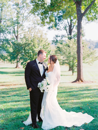 Bride and Groom Smile at Ceremony at French Chateau Destination Wedding
