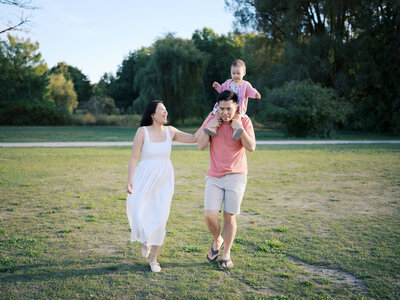 Mother and father looking at their newborn baby at a park in Squamish. 