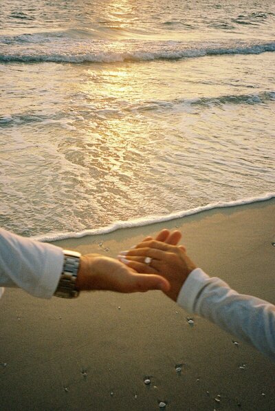 couple holding hands, taken by engagement photographer naples fl