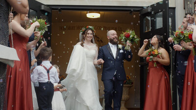 A couple exiting their wedding ceremony.