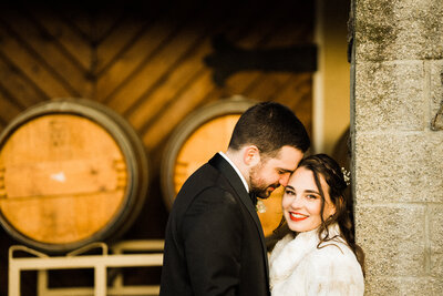 Best spots for engagement pictures in Seattle, a couple kisses at Lincoln Park, with gorgeous sunset captured by wedding photography team