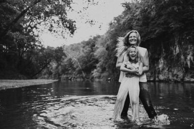 mother and daughter playing in the river in a lifestyle family photography photo session with jennifer mosier photography