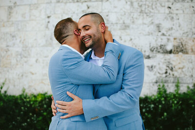 Two Grooms Hugging on their Miami Wedding Day