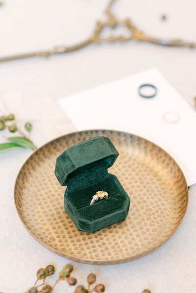 green ring box on gold plate