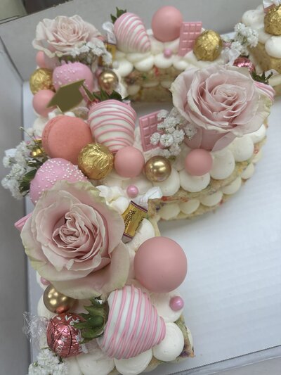 Custom number and letter cakes from Icing on the Cake Bakery, beautifully decorated with fresh toppings and perfect for birthdays, anniversaries, and special celebrations.