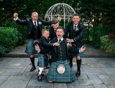 Groom and his groomsmen celebrating