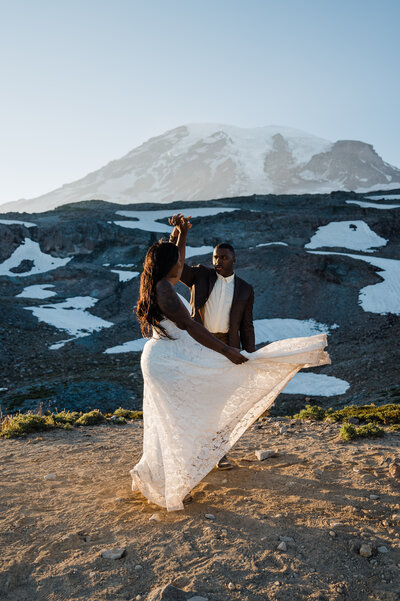 Bride and groom sharing their first dance after hiking the Skyline Trail at Mount Rainier National Park