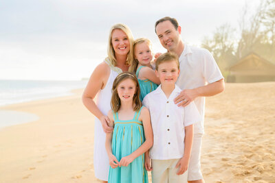 photo of a family of five, looking happy