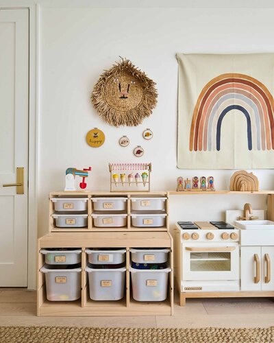 A colorful kids playroom with organized storage