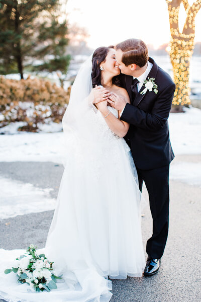 winter bride and groom during winter sunste